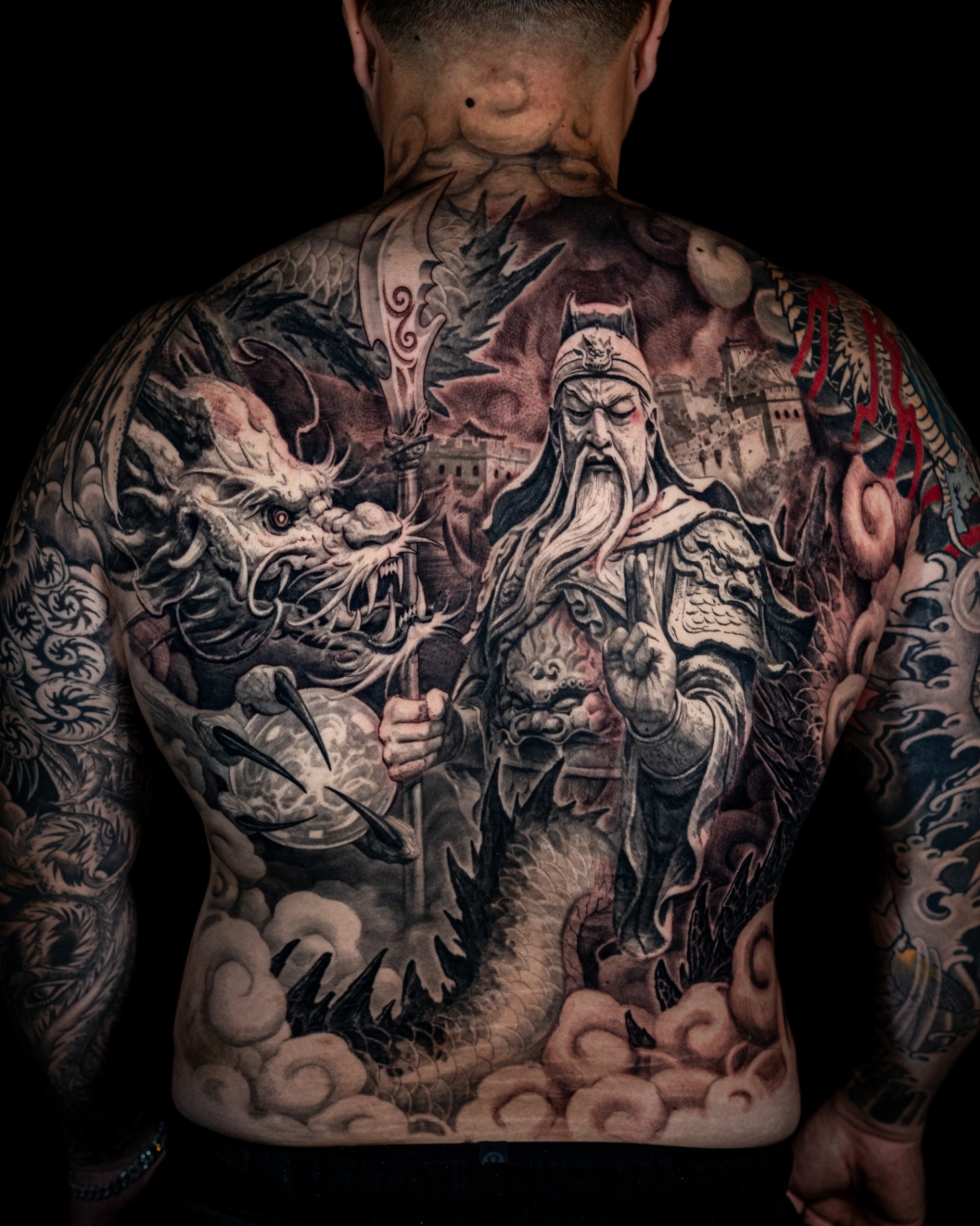 Realism warrior and dragon backpiece tattoo by Ricardo Camargo
