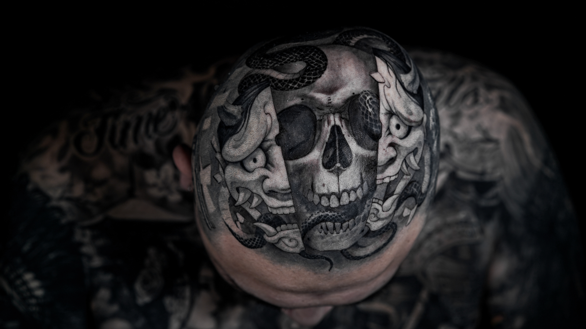 Black and grey skull and hannya scalp tattoo