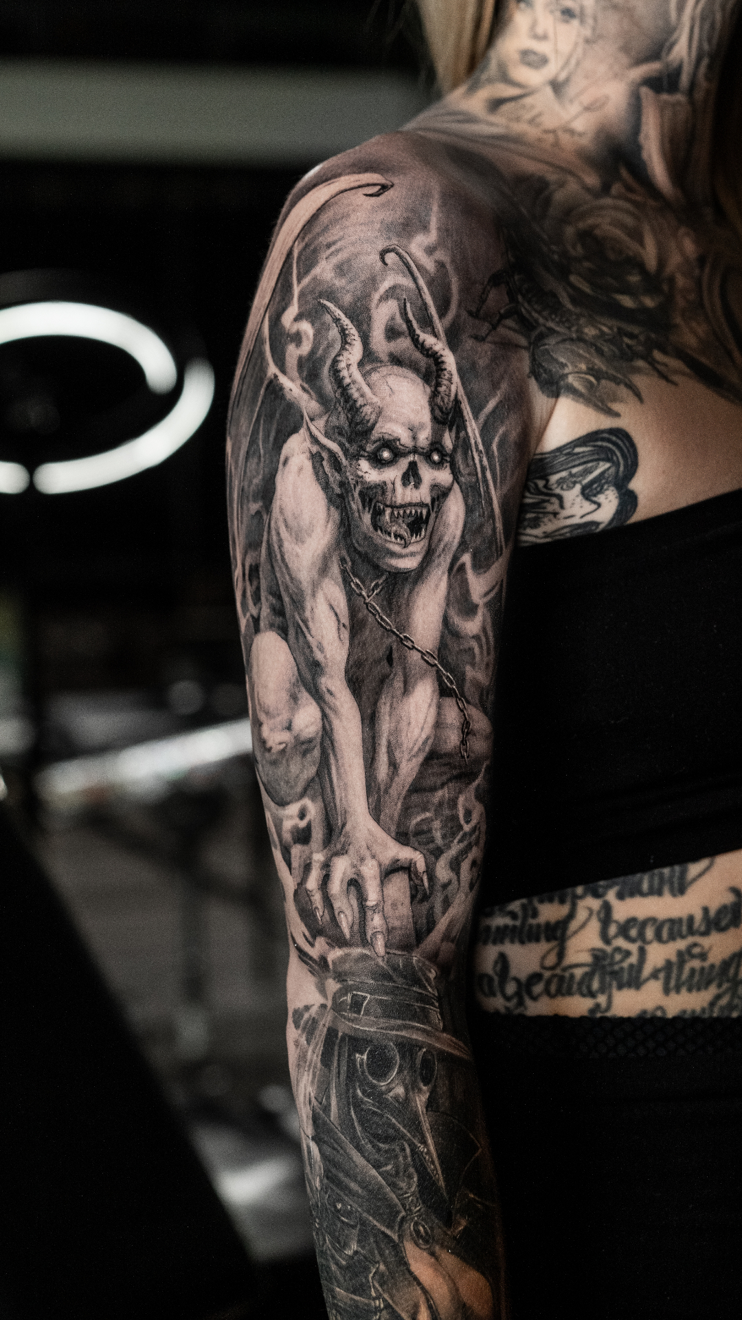 Realism demon sleeve tattoo